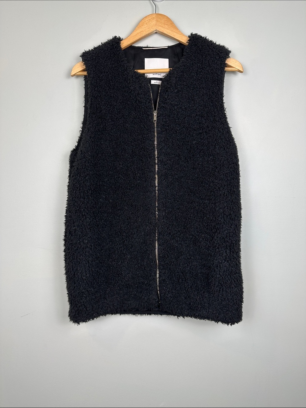 Wilfred faux Sherpa black vest gold zipper pockets layering chic Aritzia